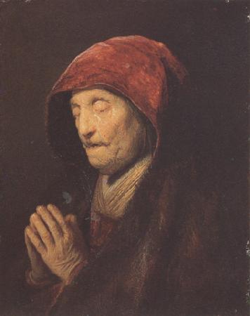 REMBRANDT Harmenszoon van Rijn An old woman at prayer (mk33) oil painting image